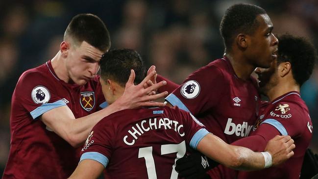 West Ham United's Mexican striker Javier Hernandez celebrates with teammates after scoring against Fulham. Picture: AFP