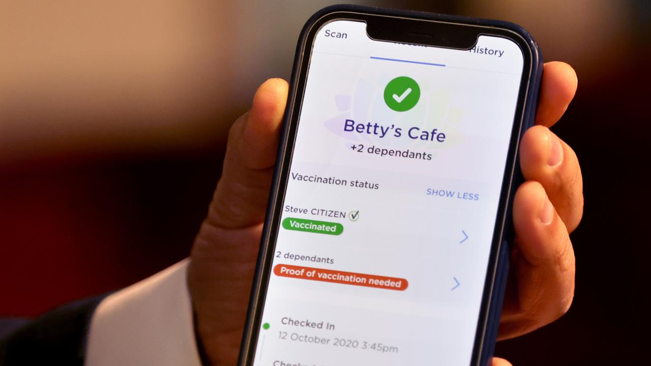 Minister Customer Service Victor Dominello pictured showing how the vaccine passport looks on a check in app (example test screen pictured). Picture: NCA NewsWire / Damian Shaw