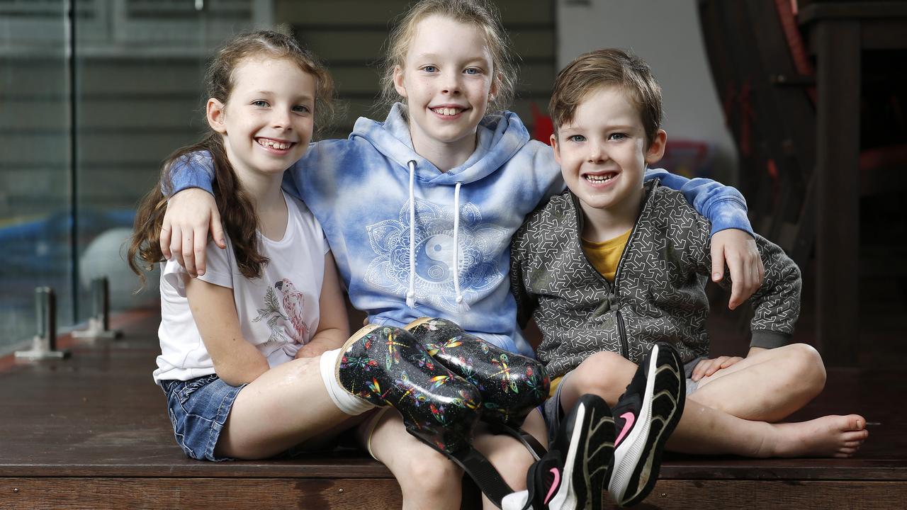 Mia Wilkinson, 8, with her siblings, Ellie, 9, and Max, 4. Picture: Josh Woning