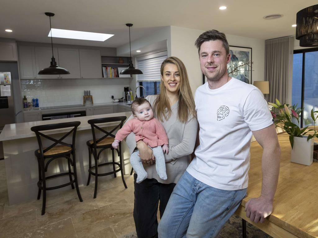 Corey and Sarah Skinner and three-month-old daughter, Everley and dog Kingsley, have looked to refinance their home loan. Picture by Wayne Taylor 11th August 2022