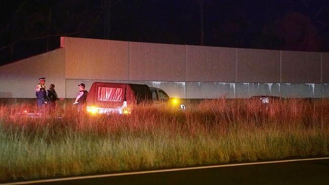 Police at the scene near Emerald Beach where a man was found in a car shot four times on Wednesday, April 7.