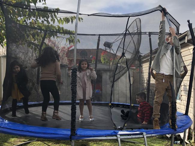 Children enjoy the joys of the trampoline during the Eid celebrations at Bilal El-Hayek’s home in Greenacre. Picture: Lawrence Machado