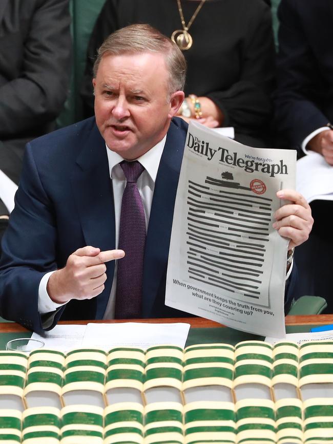 Labor leader Anthony Albanese, brandisihing several newspapers, quizzed Scott Morrison over whether he believed journalist was a crime. Picture: Gary Ramage