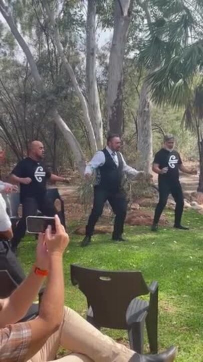 Thomas Tukiri, Farran Fitisemanu, Kane Kipa, and Tupara Morrison perform the Haka at Alice Springs Airport.