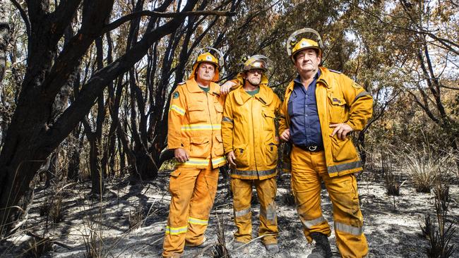 Rural Fire Service Firefighters Scott Brooks, (1st Officer, Valdora,) Mark Smith, (Officer, Doonan), and Peter Garrett, (1st Officer, Maroochy River) in burnt out scrub just off David Low Way where they fought a fierce battle against a raging bushfire on Monday night and saved the township of Peregian Beach. Picture: Lachie Millard