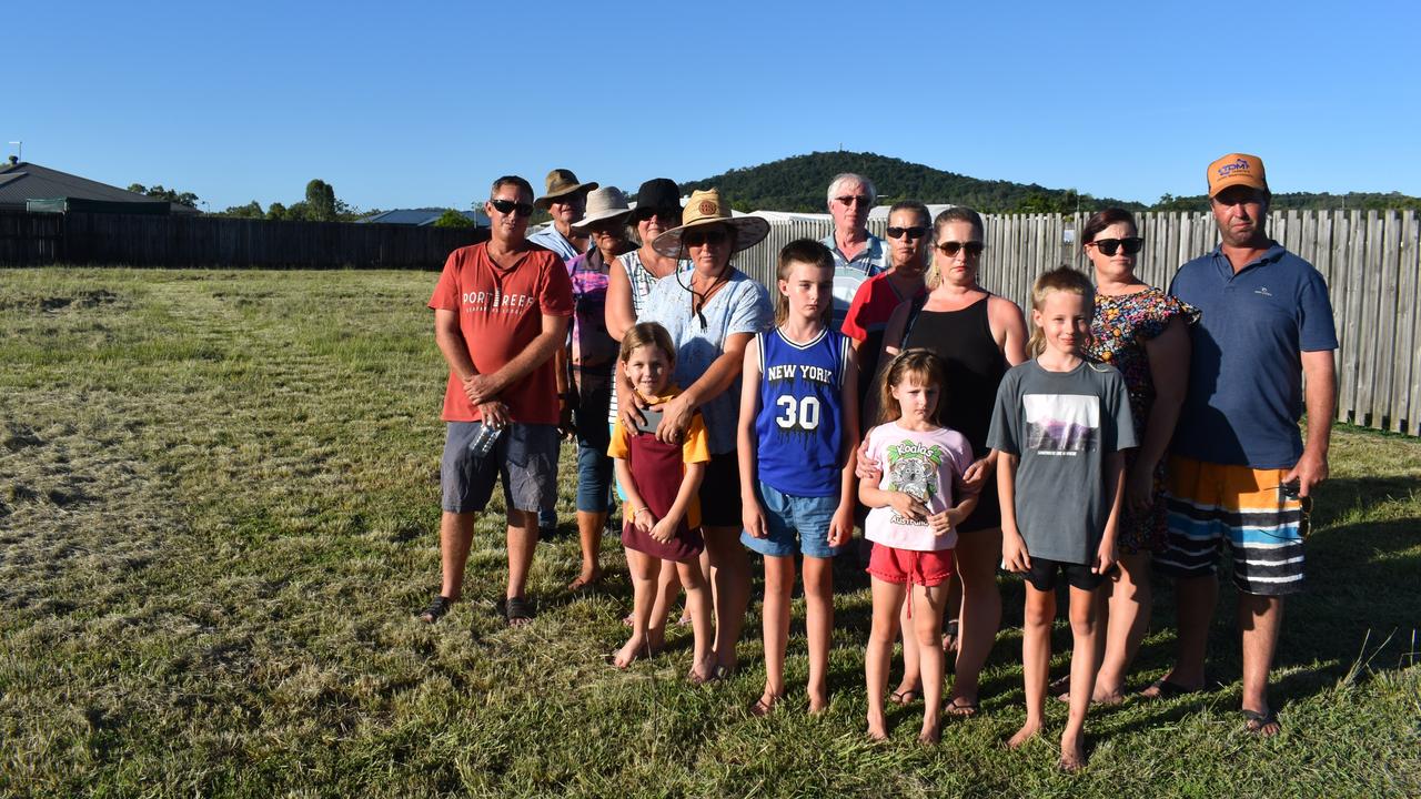 Sarina neighbours are concerned about a proposed childcare centre on Reef Drive. L to R: Jeremy Robins, Jim Williams, Lyn Williams, Lee Ross, Shannon Pearce, Kadee Wells, Alex Kentwell, Robert Doolan, Bec Keating, Stacey Ketwell, Charlotte Kentwell, Harry Kentwell, Tegan Skopp, Chris Skopp. Photo: Zoe Devenport