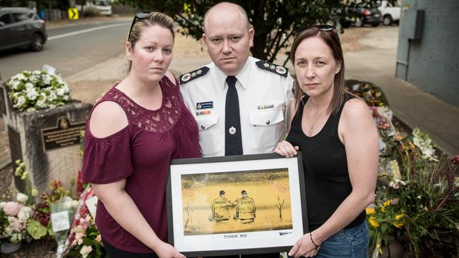 Jess Hayes, partner of Geoffrey Keaton, RFS commissioner Shane Fitzsimmons and Melissa O’Dwyer, wife of Andrew O’Dwyer at Horsley Park RFS. Picture: Flavio Brancaleone