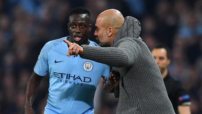 Manchester City manager Pep Guardiola gestures to defender Benjamin Mendy during the UEFA Champions League quarter final second leg between Manchester City and Tottenham Hotspur. (Photo by Ben STANSALL / AFP)