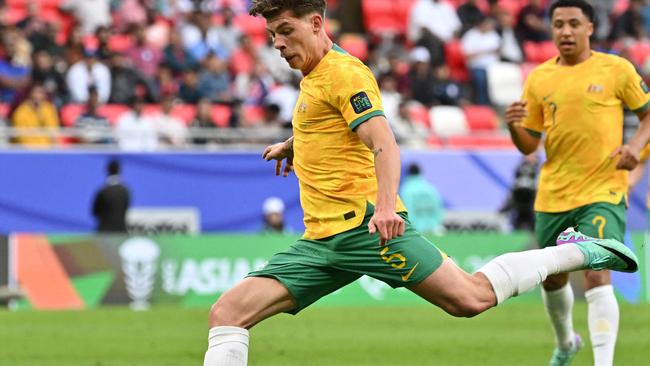 Australia's defender #05 Jordan Bos shoots the ball during the Qatar 2023 AFC Asian Cup Group B football match between Australia and India at the Ahmad bin Ali Stadium in Al-Rayyan, west of Doha on January 13, 2024. (Photo by HECTOR RETAMAL / AFP)