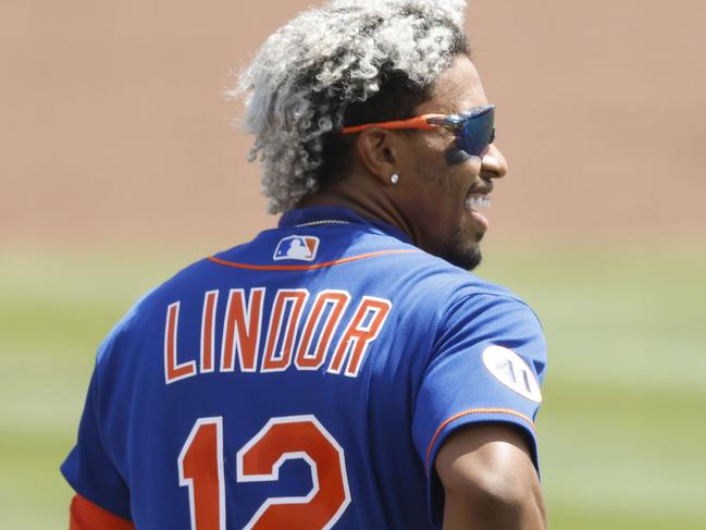 JUPITER, FLORIDA - MARCH 17: Francisco Lindor #12 of the New York Mets looks on against the Miami Marlins during the fourth inning of a Grapefruit League spring training game at Roger Dean Stadium on March 17, 2021 in Jupiter, Florida.   Michael Reaves/Getty Images/AFP == FOR NEWSPAPERS, INTERNET, TELCOS & TELEVISION USE ONLY ==