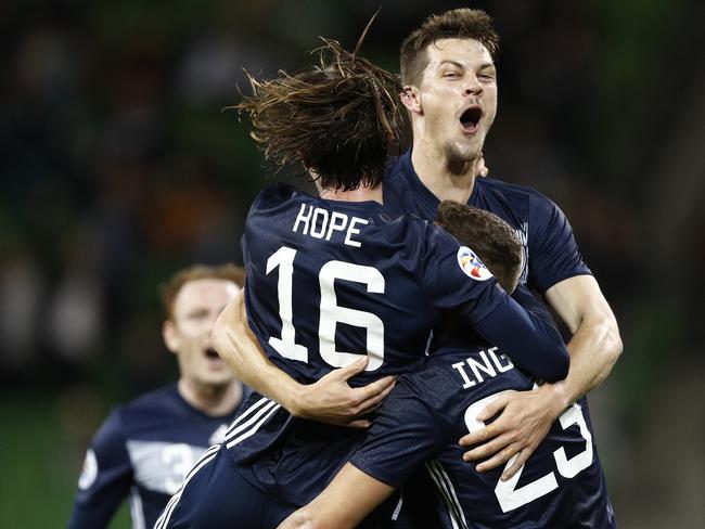 Joshua Hope (left) and James Donachie (centre) celebrate a goal to Jai Ingham of the Victory (right) during the AFC Champions League match between the Melbourne Victory  and Guangzhou Evergrande at Melbourne Rectangular Stadium, in Melbourne, Tuesday, April 23, 2019. (AAP Image/Daniel Pockett) NO ARCHIVING, EDITORIAL USE ONLY