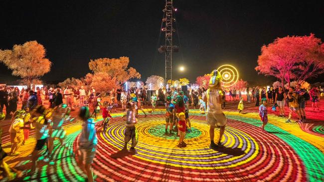 Children play in immersive light installations during the first weekend of Parrtjima. Supplied: Facebook.