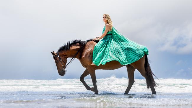 Elsa Pataky, wearing Scanlan Theodore dress, with showjumper horse Bruce. Stylist: Kimberly Gardner. Hair: Brad Mullins. Makeup: Linda Jefferyes. Picture: Luke Marsden