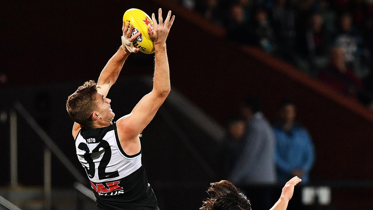 Dougal Howard of Port Adelaide spoils Mark Baguley of the Bombers. Picture: Mark Brake/Getty Images