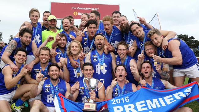 Hastings players celebrate the 2016 premiership.