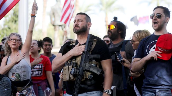 Supporters of Donald Trump listen to the national anthem at a ‘Stop the Steal’ rally in front of the state capital in Phoenix, Arizona. Picture; Getty Images/AFP