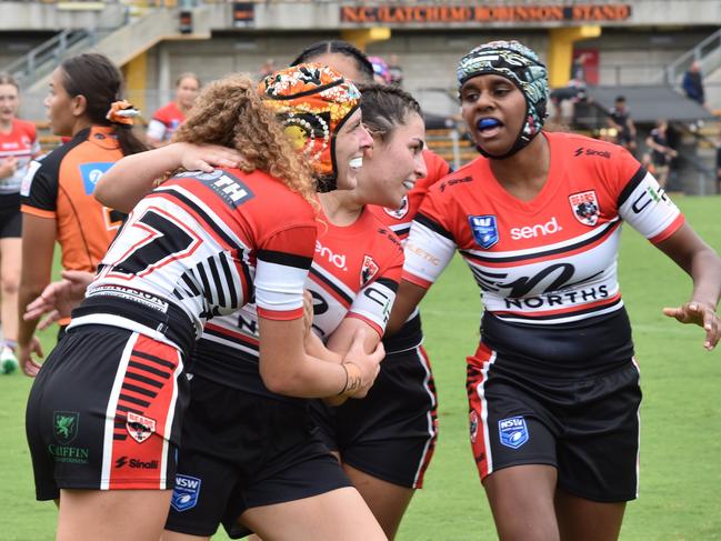 Maicy Furner (left) celebrates her try. Picture: Sean Teuma