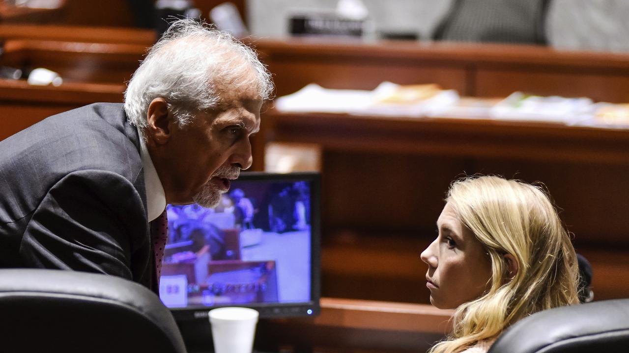 Brooke Skylar Richardson talks to lawyer Charles H. Rittgers. Picture: Nick Graham/The Journal-News via AP