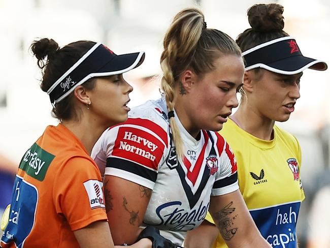 SYDNEY, AUSTRALIA - SEPTEMBER 22: Isabelle Kelly of the Roosters walks off with a suspected serious injury during the round nine NRLW match between Parramatta Eels and Sydney Roosters at CommBank Stadium on September 22, 2024 in Sydney, Australia. (Photo by Jeremy Ng/Getty Images)