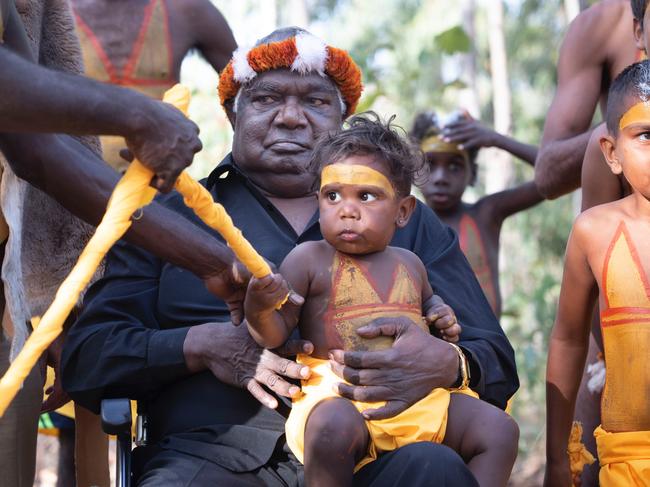 Dr Galarrwuy Yunupingu with a child of the Gumatj clan at the Garma Festival. Photographer: PETER EVE