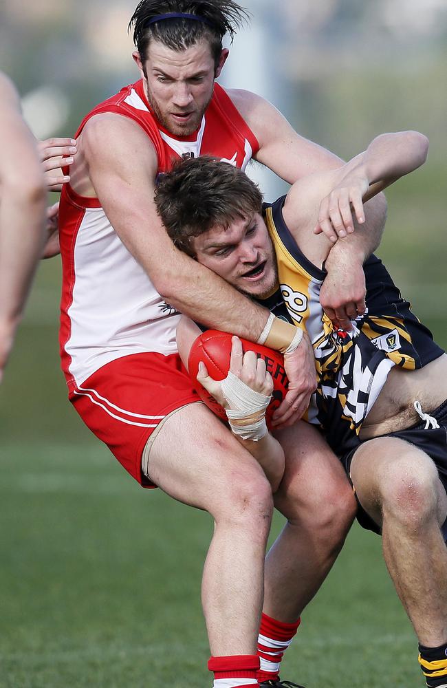 Aaron French laying a tackle for Clarence in Tasmania.