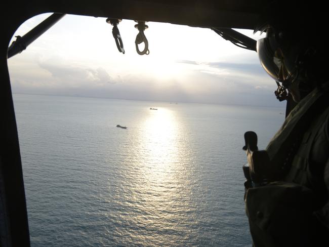 Republic of Singapore air force personnel conduct a search and rescue operation for missing US sailors over waters east of Singapore. Picture: AP