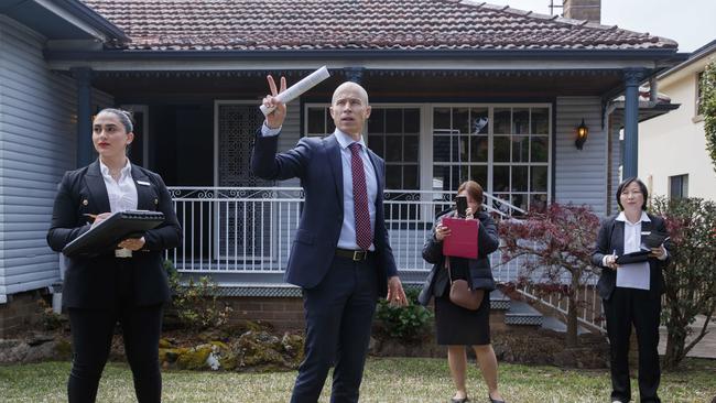 Auctioneer Anthony Meaker (centre) calls bids at a recent Eastwood auction. Picture: David Swift