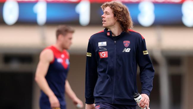 AFL. Melbourne v Richmond practise match at Casey Fields, Cranbourne. Ben Brown runs the drinks for Melbourne after recent knee surgery keeps him out of todays match . Pic: Michael Klein