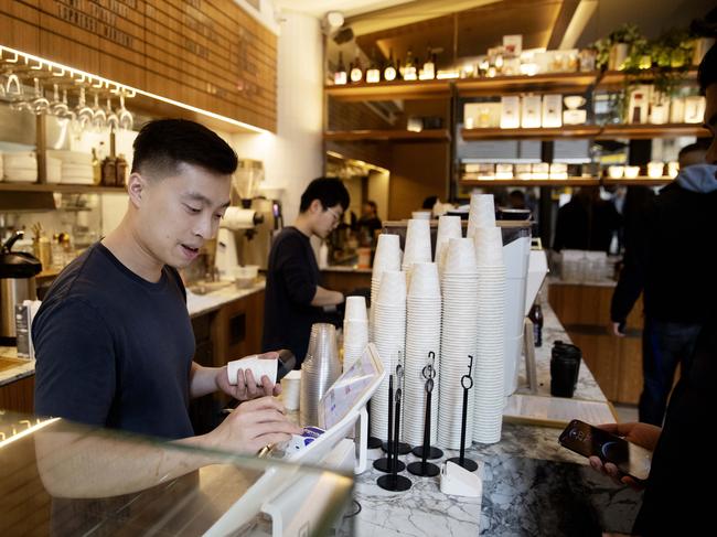 Workers at Regiment Cafe in Sydney’s CBD on Friday. Picture: NCA NewsWire / Nikki Short