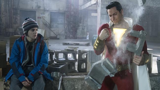 This image released by Warner Bros. shows Zachary Levi, right, and Jack Dylan Grazer in a scene from "Shazam!" (Steve Wilkie/Warner Bros. Entertainment via AP)