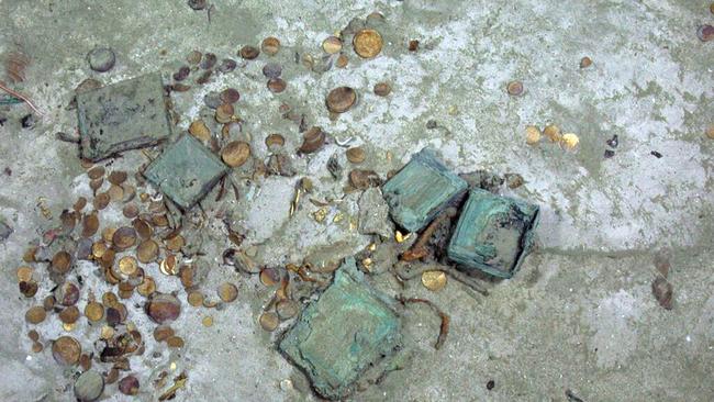 Cash’n’carry ... One of the piles of gold coins, lying on the surface, outside the SS Central America shipwreck hull. Picture: Odyssey Marine Exploration, Inc., www.odysseymarine.com