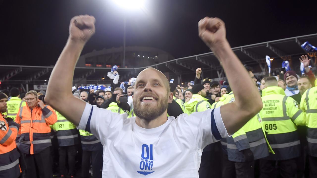 Teemu Pukki of Finland celebrates the victory in front of their fans after the UEFA Euro 2020 Group J qualification football match between Finland and Liechtenstein in Helsinki, Finland, on November 15, 2019. - Finland has qualified for the first time for a major football tournament. (Photo by Markku Ulander / Lehtikuva / AFP) / Finland OUT