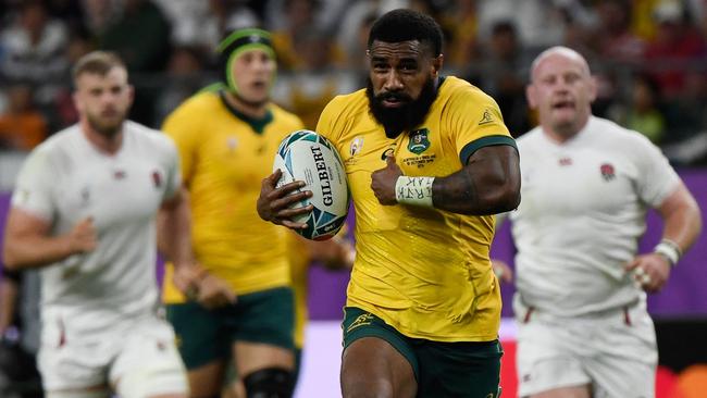 Wallabies winger Marika Koroibete makes a break against England in the Rugby World Cup quarter-final in Oita. Picture: AFP