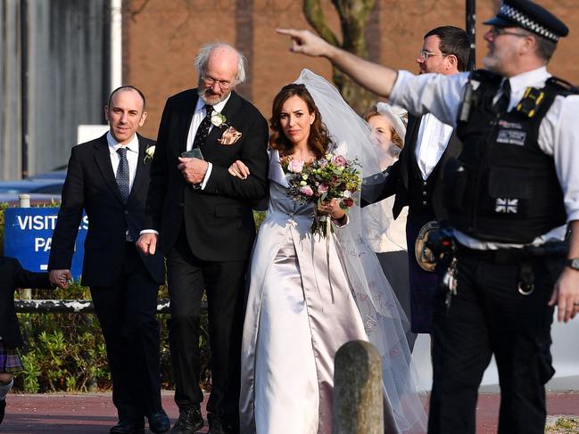 John Shipton (L), father of Julian Assange, walks with his son's partner Stella Moris (C) as they leave from Belmarsh Prison in London where she married Assange. Picture: AFP