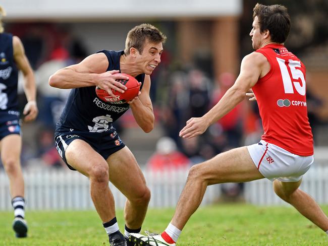 18/05/19 - SANFL: North Adelaide v South Adelaide at Prospect Oval.  Souths' Joel Cross takes on Norths' Tom Schwarz. Picture: Tom Huntley