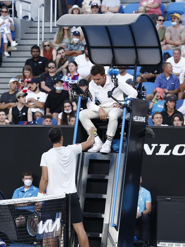 Mate Pavic argues with the chair umpire, with tensions spilling over in the locker room later. Picture: Darrian Traynor/Getty Images)