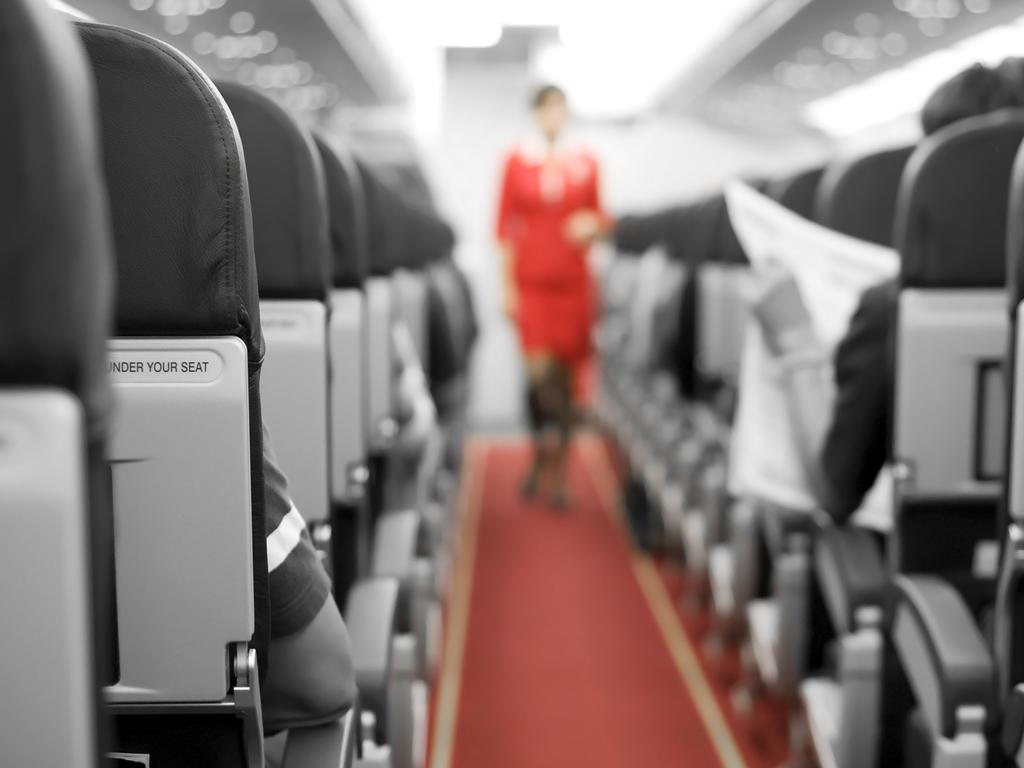 ESCAPE: TIGHT_TRAVELLER, Angus Kidman- 10MAR19- Air Travel with seats and cabin crew in background - Inside the plane Picture: iStock