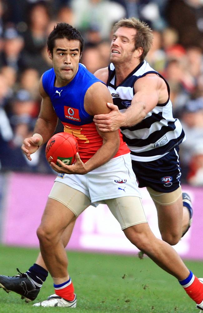 Scott Harding tries to break free from Geelong’s Joel Corey.