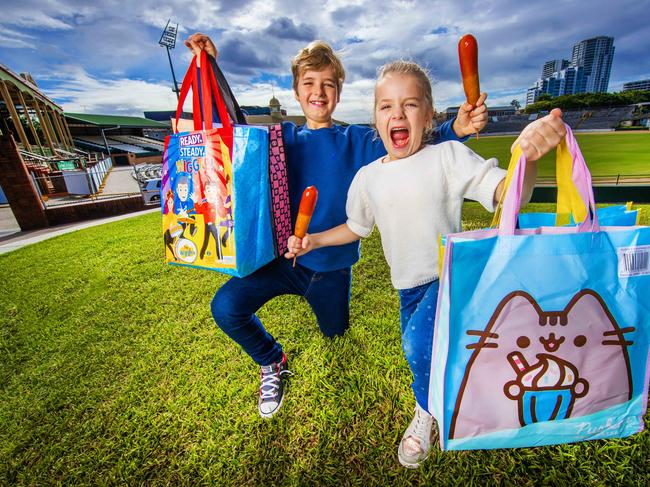 Ekka 2024 half price tickets. Hugo, 10 and Matilda Daly, 7 with showbags and dagwood dogs ahead of the Ekka.Picture: Nigel Hallett*****Alex MUM ******0405699971***********