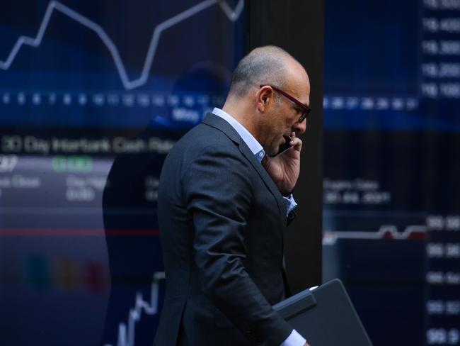 SYDNEY, AUSTRALIA - NewsWire Photos JUNE 01, 2021: A bussiness man is seen walking past the ASX in Sydney, Australia. Picture: NCA NewsWire / Gaye Gerard