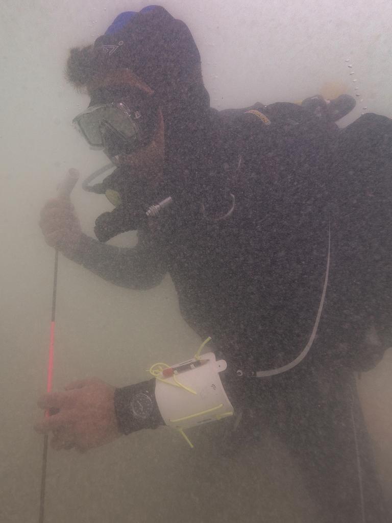 SA’s maritime heritage officer Mark Polzer probes the seabed. Image: Ruud Stelten.