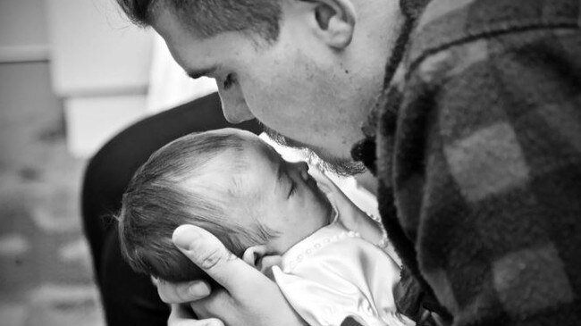 Jarred Harper holding Raevyn Harper. Picture – GoFundMe.