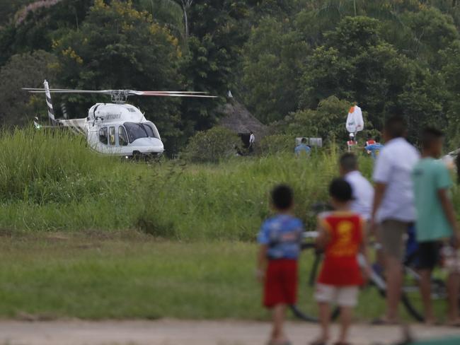 A helicopter believed to be carrying one of the boys rescued from the flooded cave lands in Chiang Rai. AP