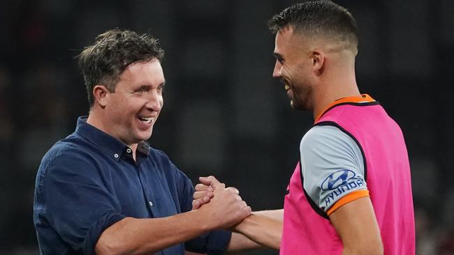 Roar coach Robbie Fowler celebrates a win with Bradden Inman. Picture: AAP