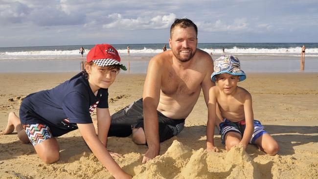 Holiday photos at Mooloolaba Beach. The Signall Family from Darwin and New South Wales. From left is 9 year old Dane with Christian and 5 year old Riley.