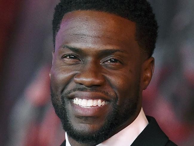 FILE - In this Dec. 11, 2017 file photo, Kevin Hart arrives at the Los Angeles premiere of 