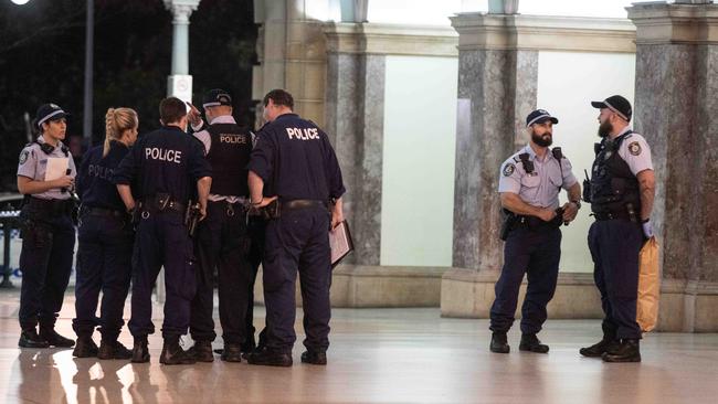 Police search the area after the stabbing. Picture: Flavio Brancaleone