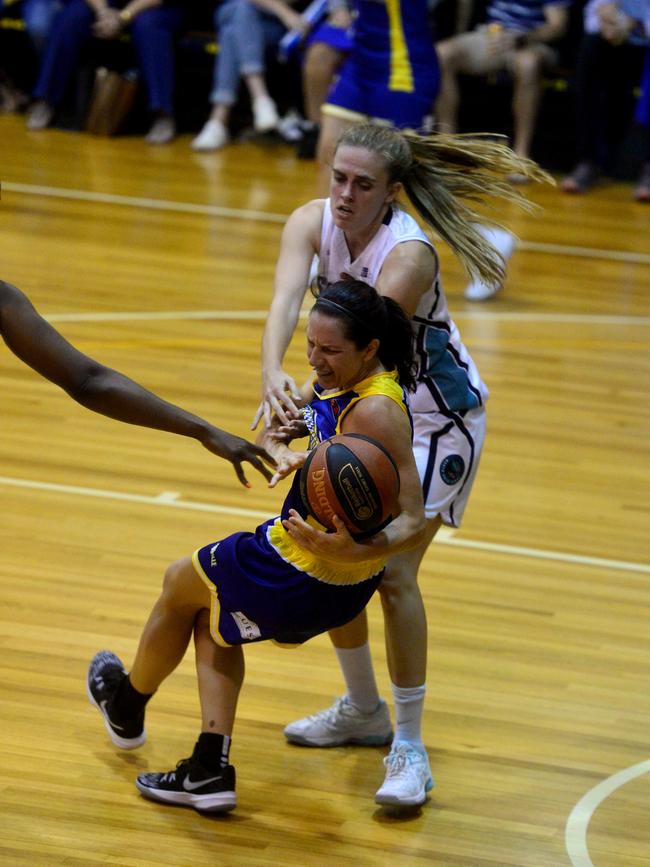 Queensland Basketball League quarter finals at Townsville Basketball Stadium. Townsville Flames against North Gold Coast Seahawks. Seahawks' Lauren Jansen fights for the ball with Flames' Micaela Cocks. Picture: Evan Morgan