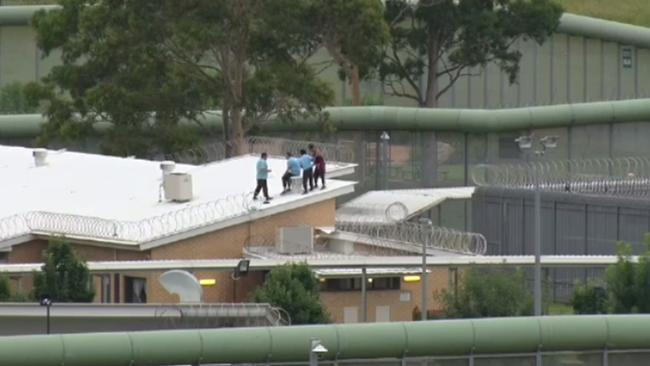 Detainees on top of a roof at the Cobham Juvenile Justice Centre in Werrington. Picture: 9 News