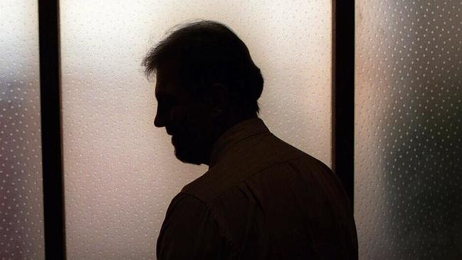 Generic image. Silhouette of a man (parent of) a sex abuse victim in an office. wrongly accused of touching young girl. Child sexual abuse. sex crime incest paedophilia.